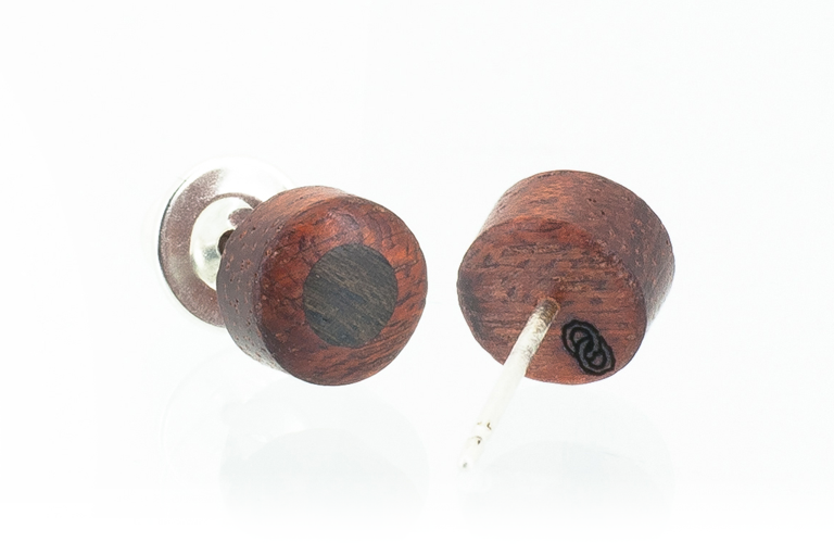 Wood round shaped earrings. Made in Bloodwood. View of logo on back.
