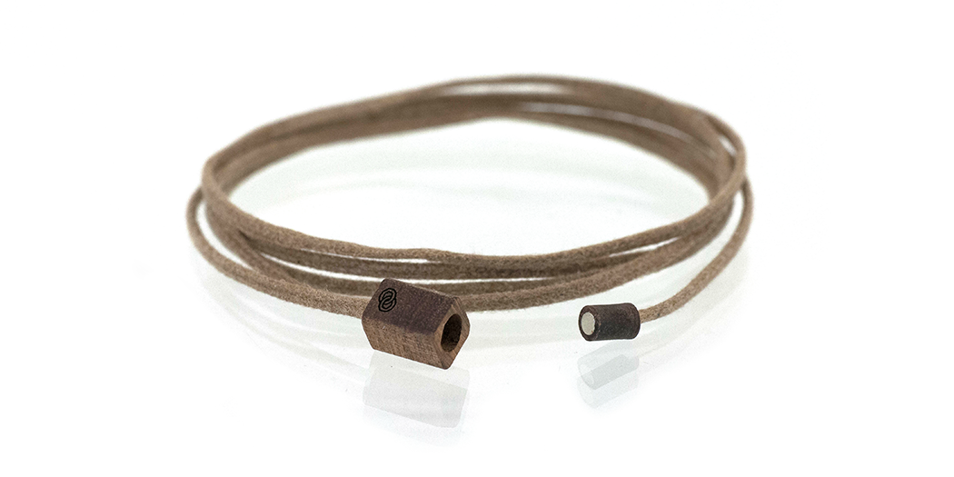 Wood bracelet. Chechen wood with tan cotton cord wrap. Logo shown.