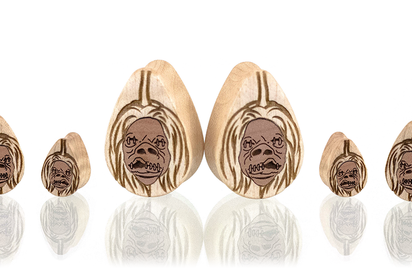 Wood teardrop shaped ear gauges with candy corn inlayed with wood