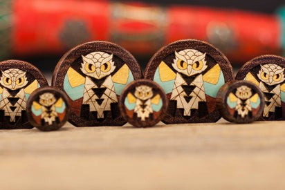 Wide Old Owl wood ear gauge style plug spread. 