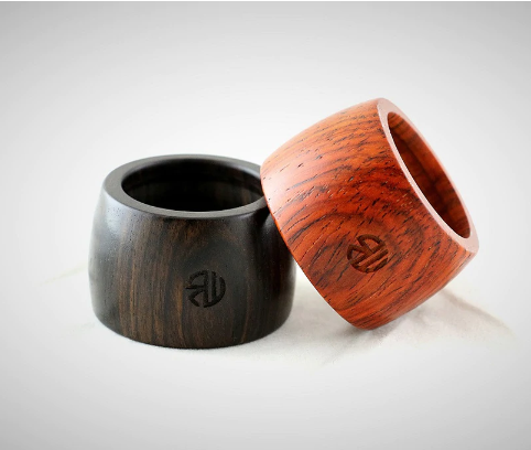 Custom wood saxophone ligatures with logo laser etched on them. 