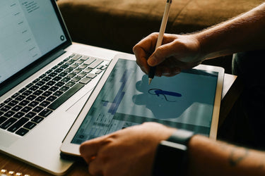 Closeup of designer drawing on touch screen. 