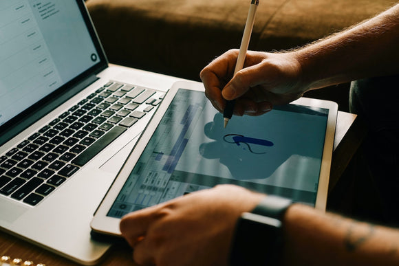 Closeup of designer drawing on touch screen. 