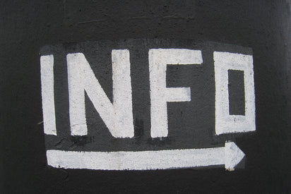 The word Info painted in white on a black wall.