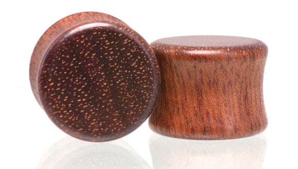 Ear gauge plugs made in Bloodwood. 