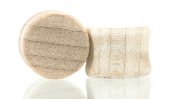 Ear gauge plugs made in Curly Maple wood. 