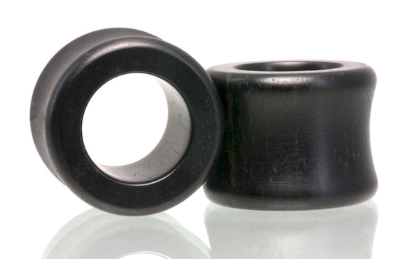 Flatty Tunnel ear gauge plugs in Ebony wood.