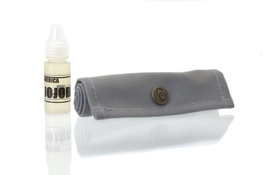 Omerica touchup kit with bottle of jojoba oil. 