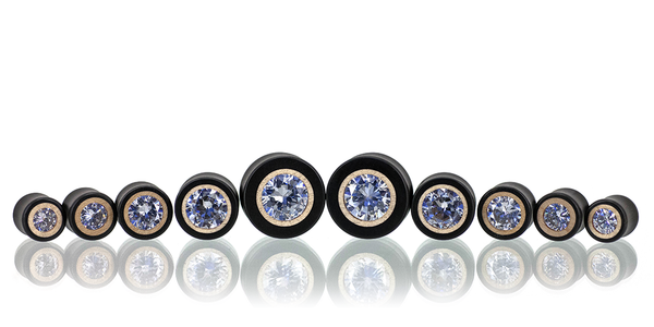 Clear CZ pair of ear gauges in Ebony wood with a Maple inlay. 