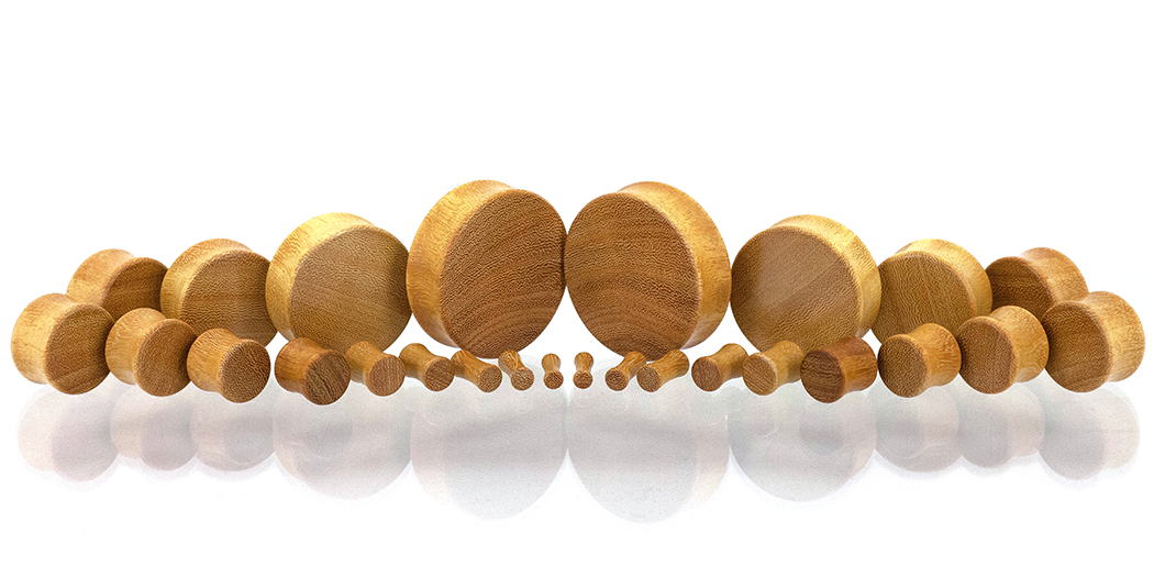 Ear gauges, wood plug made in Osage Orange wood. Gauge size spread. 