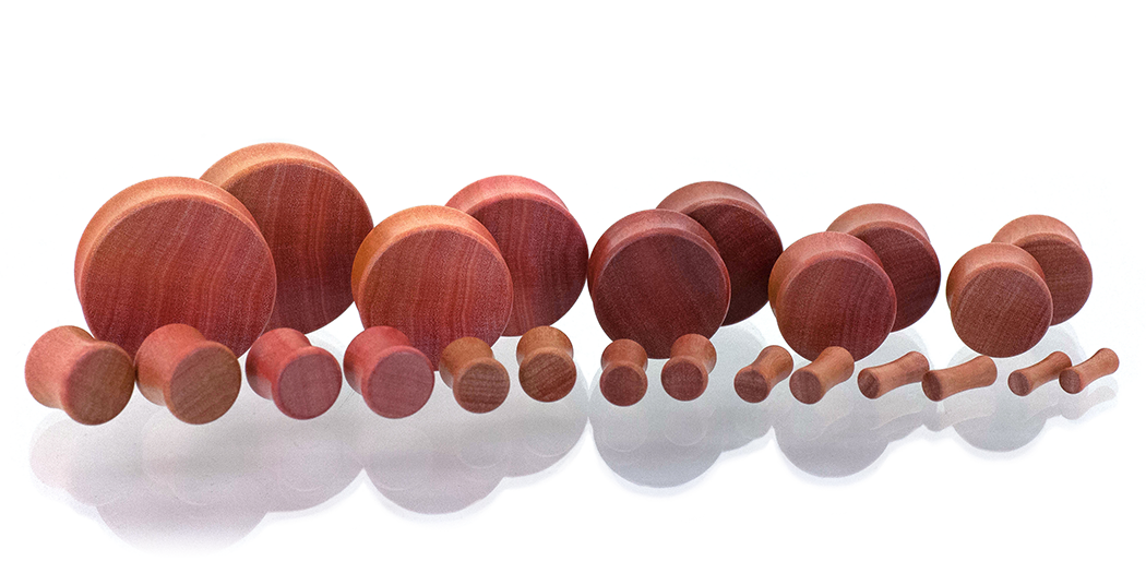 Ear gauges, wood plug made in Pink Ivory wood. Gauge size spread. 
