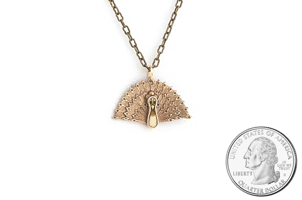 Peacock pendant made in Bronze metal with Hollywood inlay. Size scale. 
