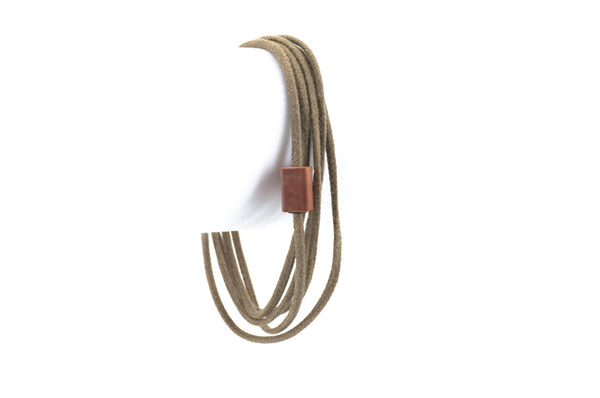 Wood bracelet. Pink Ivory wood with tan cotton cord wrap.