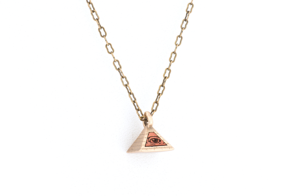 Pyramid pendant necklace. Bronze with wood inlay. Close up. 