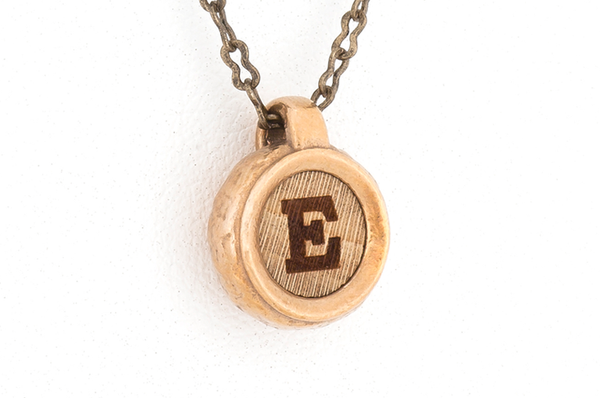 Custom letter pendant. Bronze metal with Curly Maple wood inlay. 
