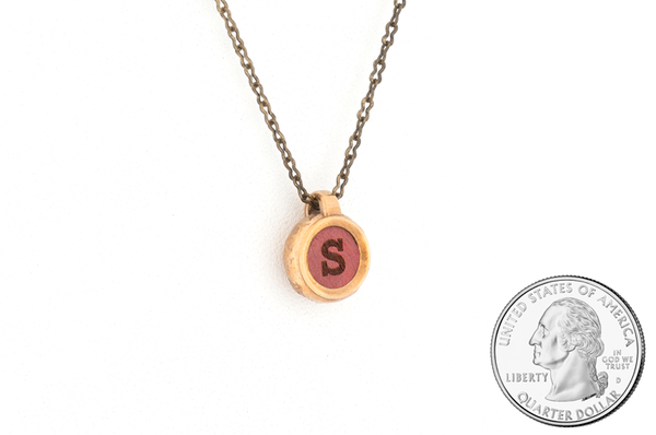 Custom letter pendant. Bronze metal with Pink Ivory inlay. Size scale. 