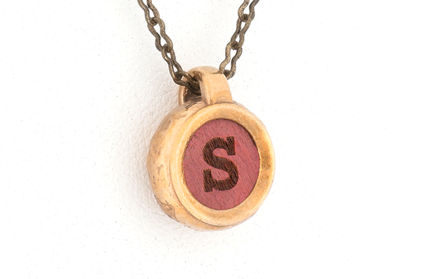 Custom letter pendant. Bronze metal with Pink Ivory inlay. 