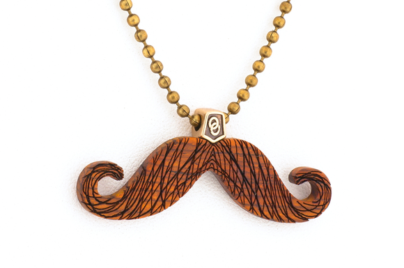 Mustache pendant. Made i Cocobolo wood with bronze hardware.
