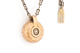 Back of custom letter pendant. Bronze metal with wood inlays. 