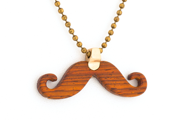 Back of Mustache pendant. Made in Cocobolo wood with bronze hardware.