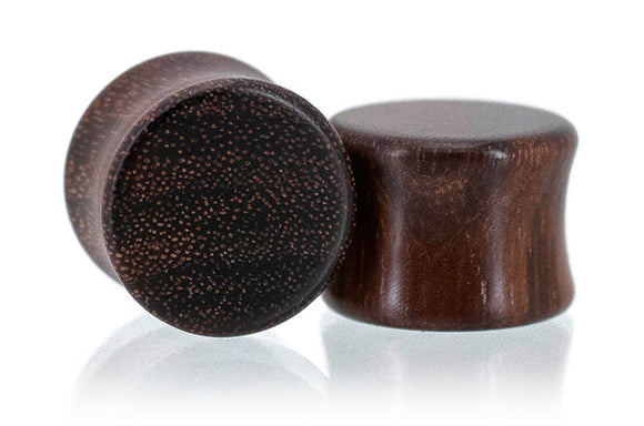 Ear gauges, wood plug made in Granadillo wood.