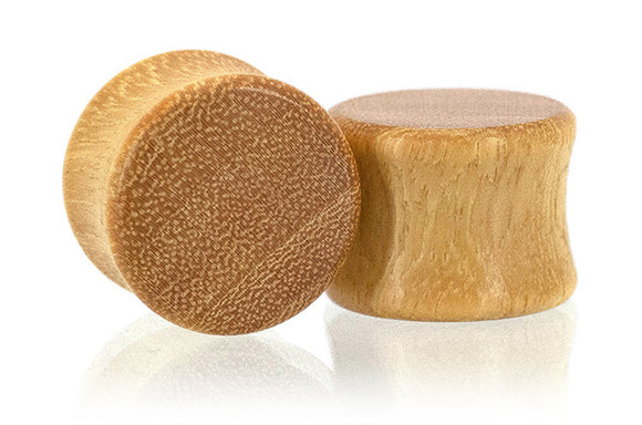 Ear gauges, wood plug made in Osage Orange wood.