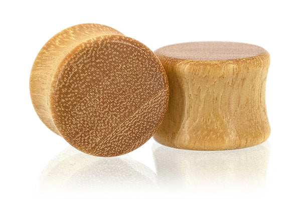 Ear gauges, wood plug made in Osage Orange wood.